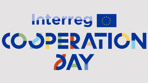 Logo for Interreg Cooperation Day with the European Union flag. The word "COOPERATION" is written in bold, colorful letters, and "DAY" is below it in similar style on a light background.